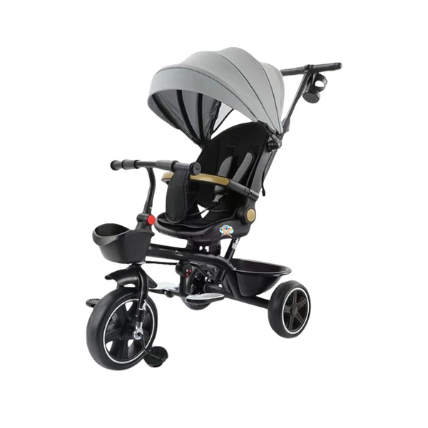 A black and gray Little Bambino Trendsetter baby tricycle with a rotating seat, adjustable canopy, and front storage basket.