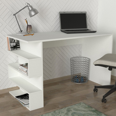White L-shaped study desk with a laptop, lamp, and books in a room with a geometric wall pattern.