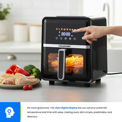Black air fryer with digital display on a kitchen counter, surrounded by vegetables and food.