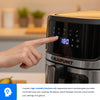 Person adjusting settings on a Blaupunkt kitchen appliance with a blurred kitchen background