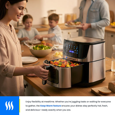 Woman using a Breville smart kitchen appliance in a home setting with family around a table.