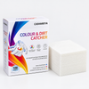 A box of Cashareya Colour & Dirt Catcher dye absorption tablets next to a stack of white square sheets on a clean white background.