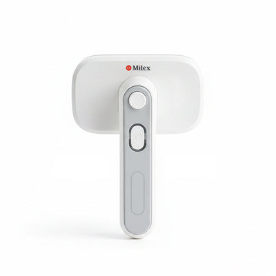 White handheld pet brush with a Milex logo on a white background