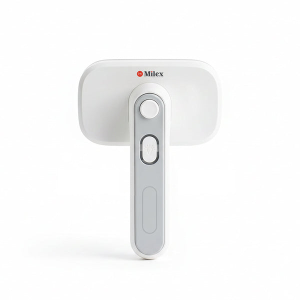 White handheld pet brush with a Milex logo on a white background