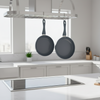 Two gray frying pans with handles on a white background