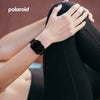 Person wearing a black smartwatch with 'Polaroid' branding in the corner.