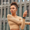 Woman wearing a Polaroid Bluetooth Calling Smart Watch with a blurred building background, featuring the Polaroid logo.
