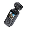 Polaroid PowerShot G11 compact action camera in matte black, featuring a textured grip, a top-mounted viewfinder lens, and a color display screen showing a selfie.