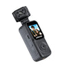 Polaroid PowerShot Lenses P200 compact camera in matte black, featuring a built-in lens mount and a small color display screen showing a selfie of two people.
