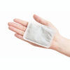 White adhesive patch on a person's palm against a white background