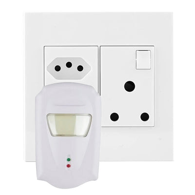 A ultrasonic pest device plugged into a wall socket on a white background