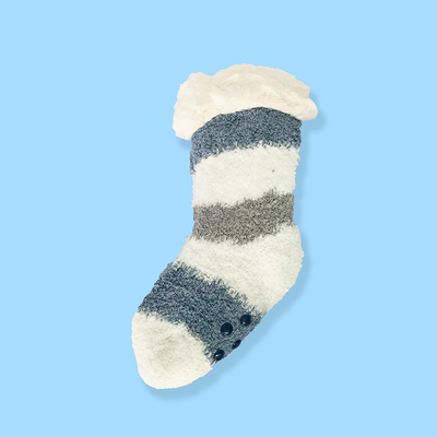 Striped sock with fuzzy texture on a light blue background